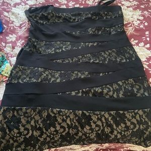 Black and “nude” mini dress